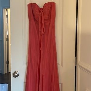 Long strapless flowy dress in a peach color